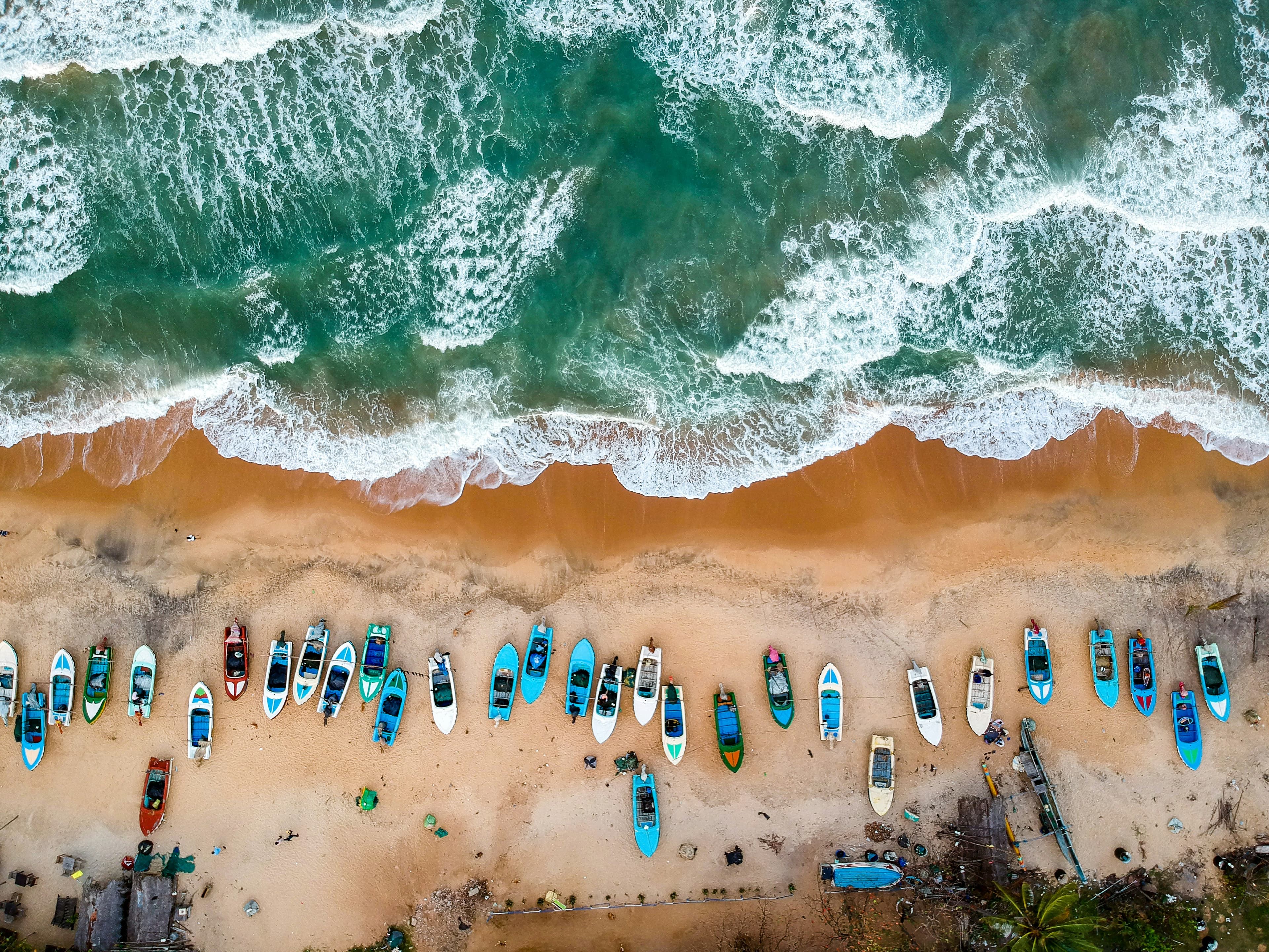 Aerial view of fishing boats on the shore at Arugam Bay